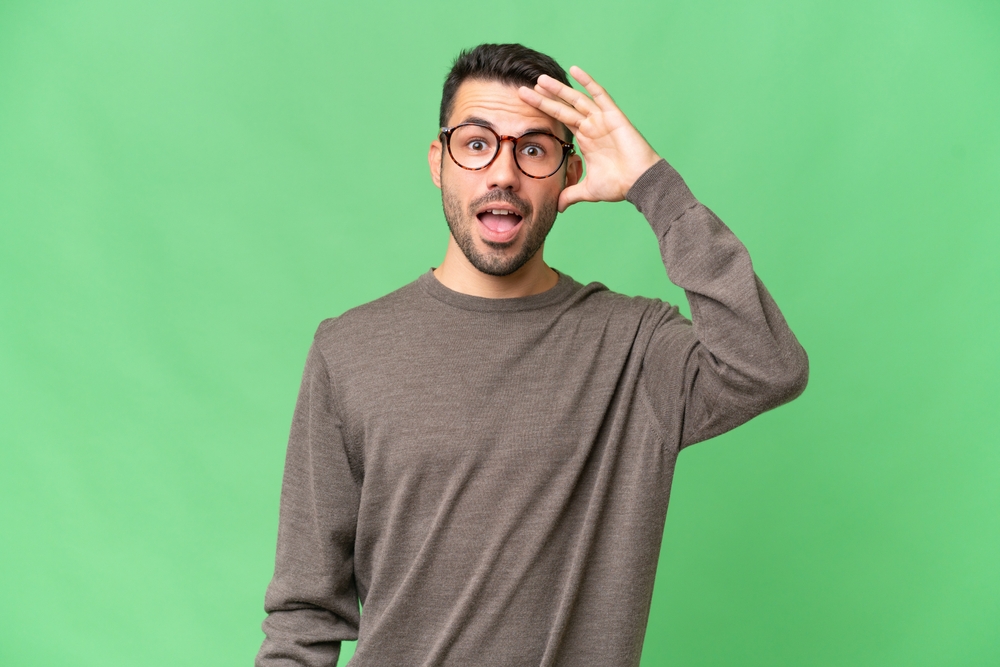 Young handsome caucasian man over isolated background has realized something