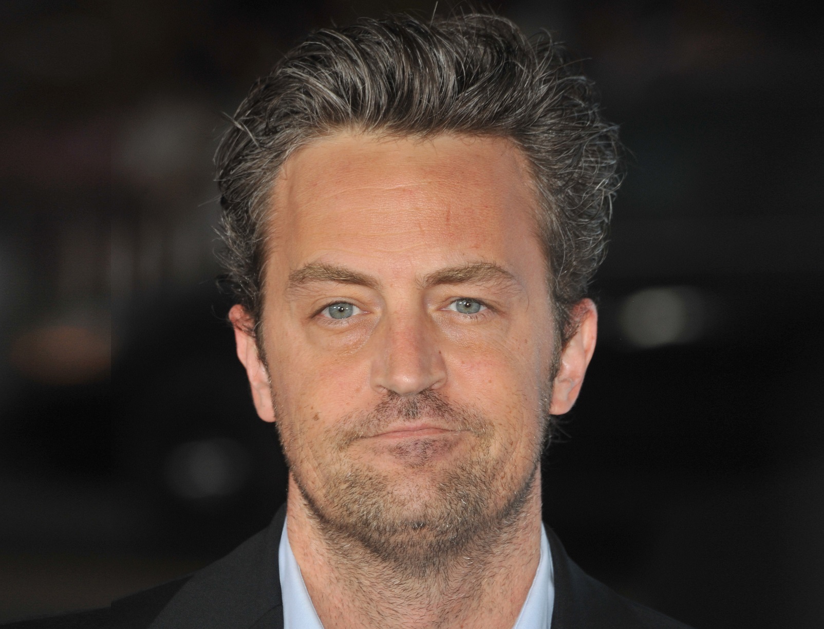 Matthew Perry looking sad at camera - 2009