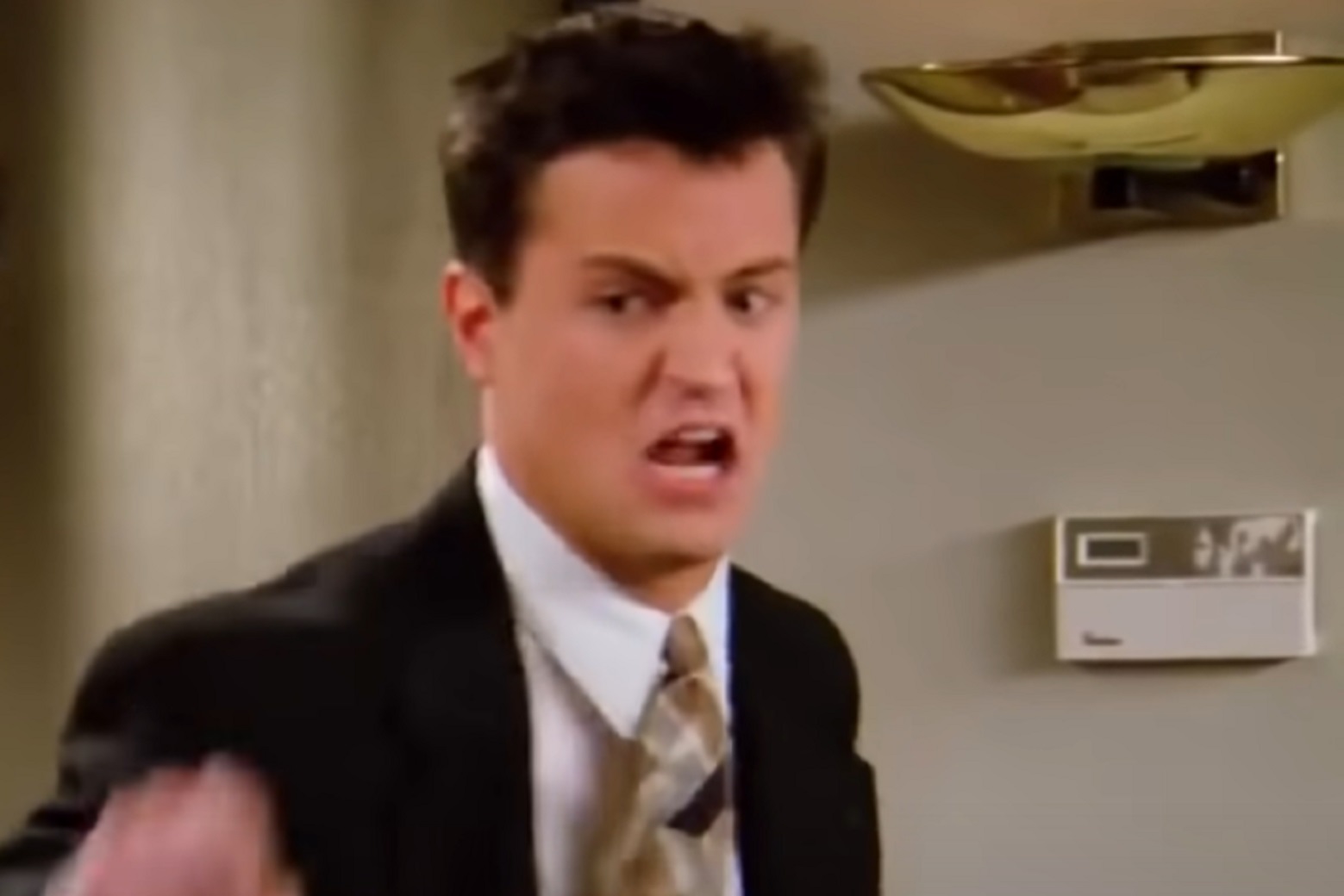 Screenshot: Matthew Perry is looking upset and yelling  - from Friends (1994-2004)