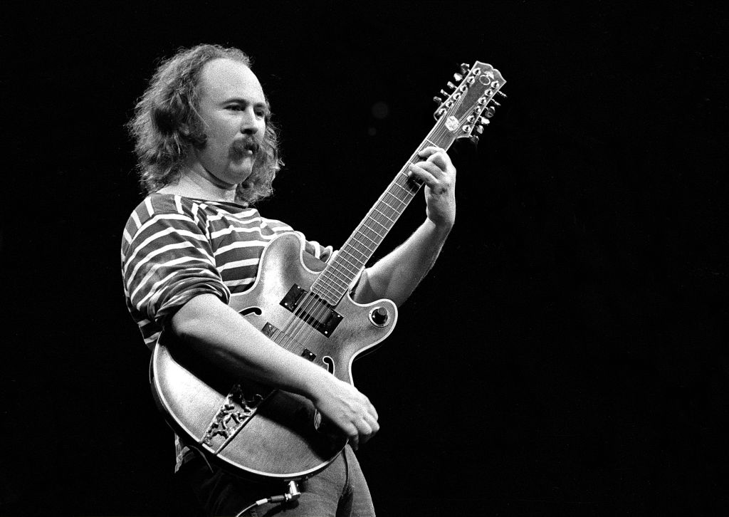 David Crosby performing with Crosby, Stills & Nash at the Boston Garden on June 14, 1977 in striped t-shirt