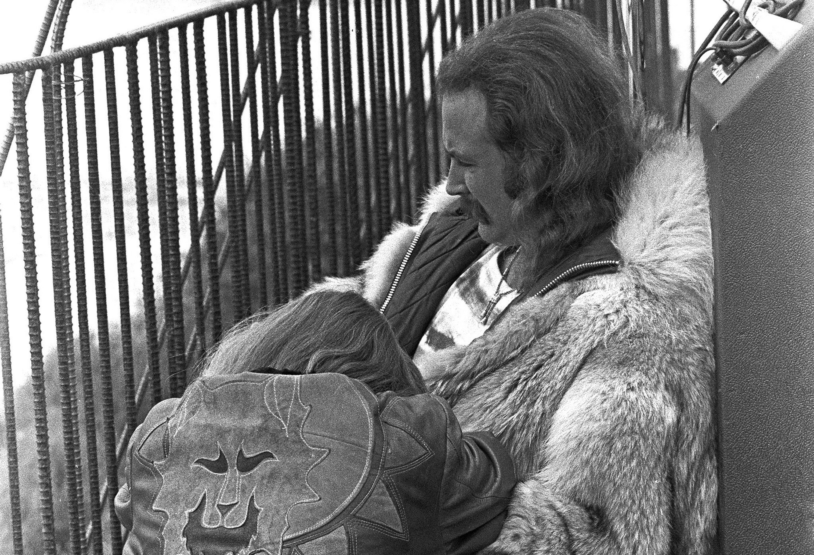 David Crosby of Crosby, Stills and Nash and Young sits with his girlfriend Christine Hinton backstage at the Big Sur Folk Festival