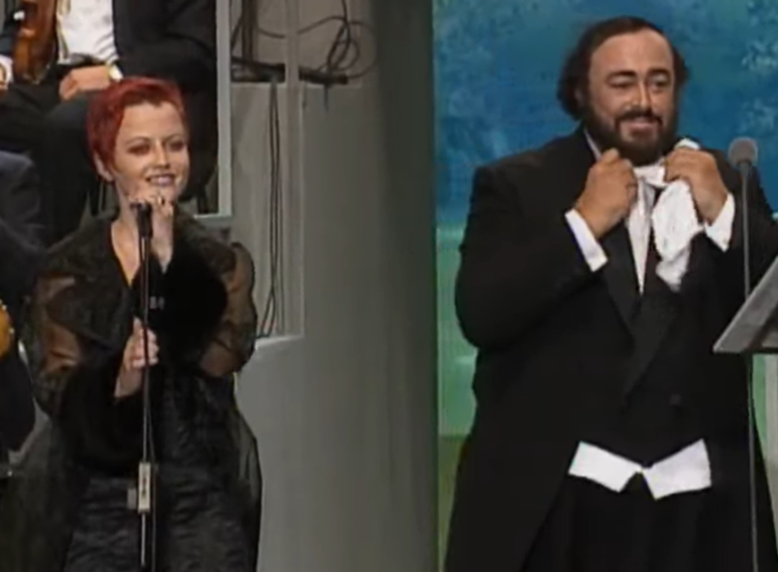 Screenshot: Dolores O'Riordan performing live on stage with Luciano Pavarotti - from Dolores (TV documentary,2018)