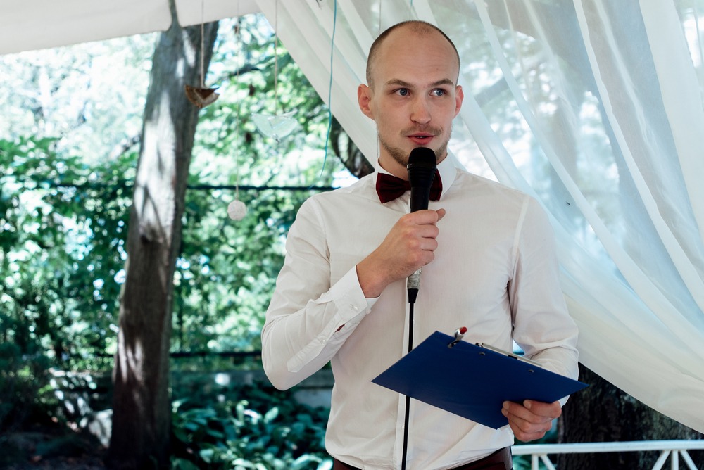 stylish handsome  wedding guest performing speech