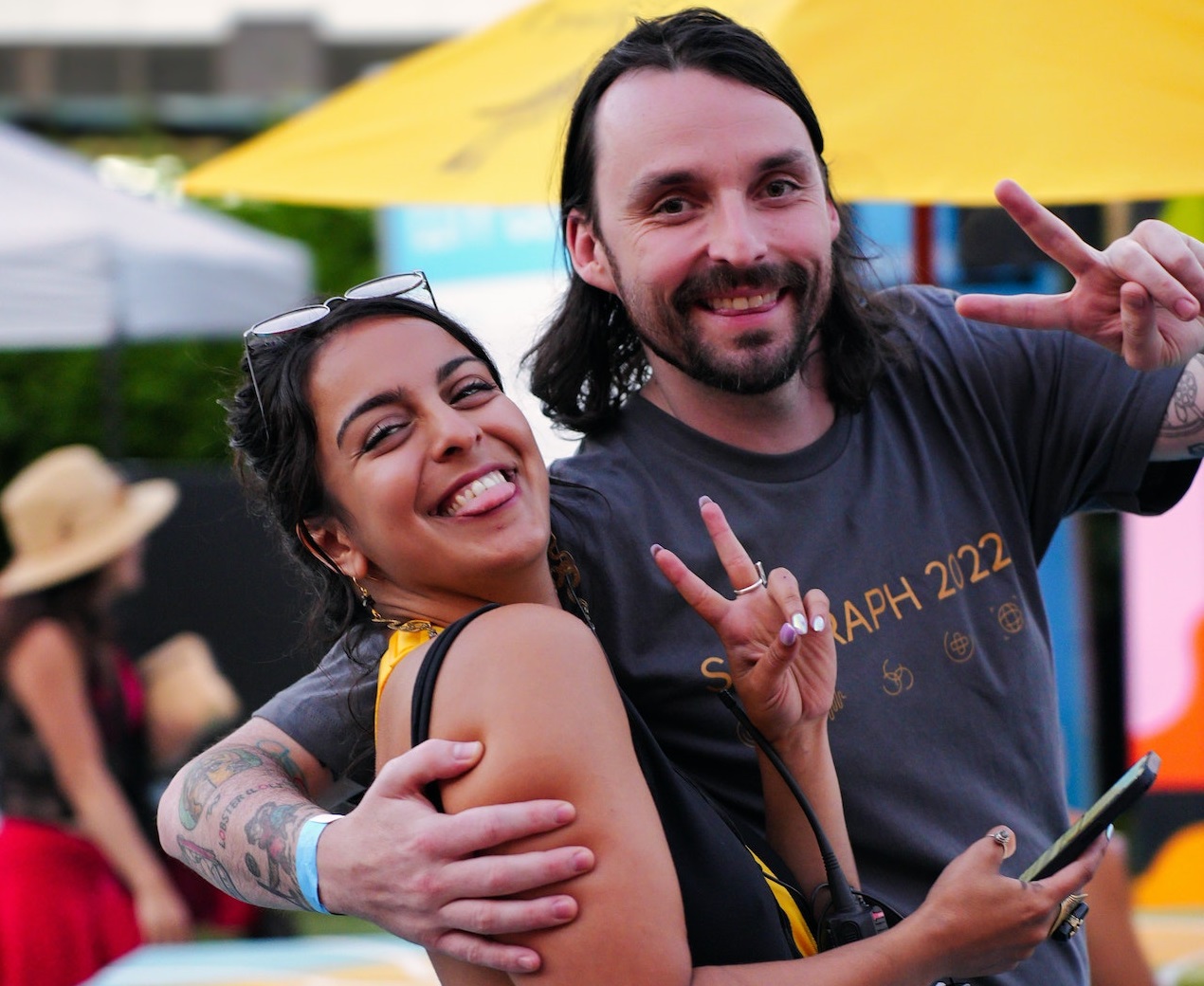 Smiling couple are looking at camera.