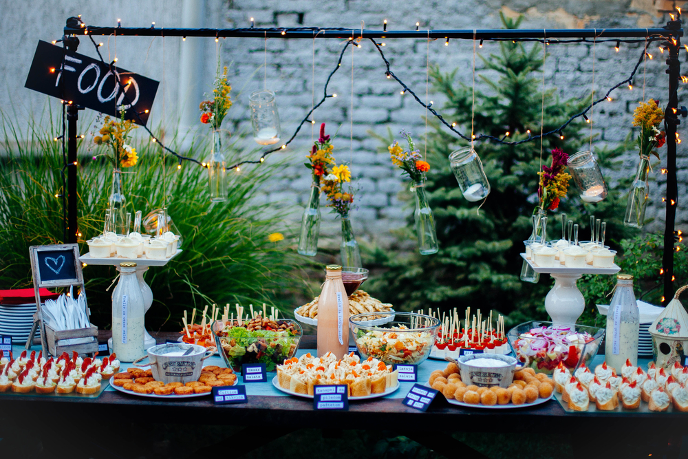Table  at  a Wedding party in the yard full of different finger food