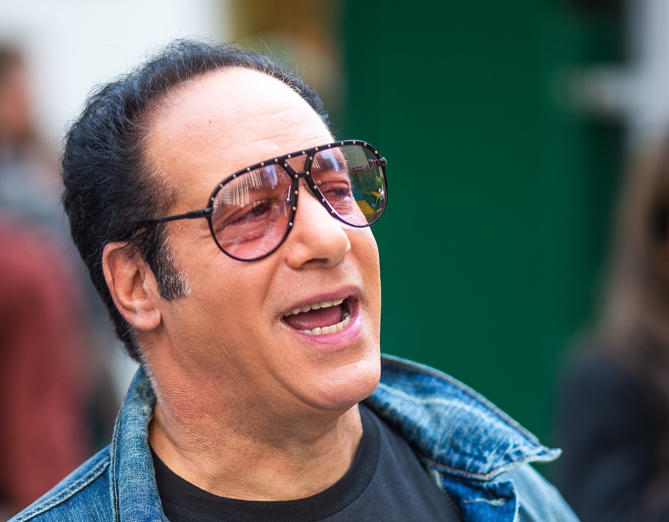 Andrew Dice Clay looking at side and smiling - 2013