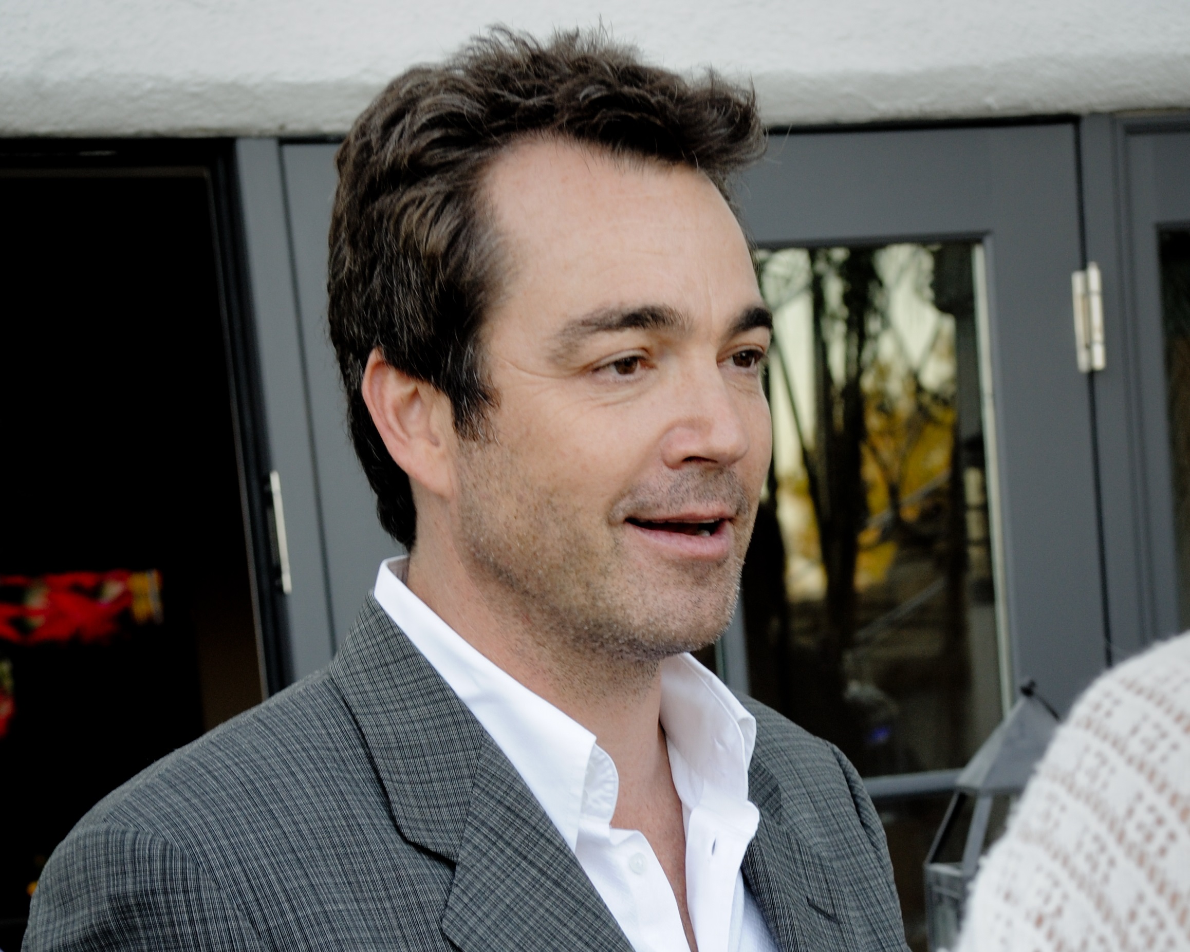 Jon Tenney is talking and looking at side - 2011