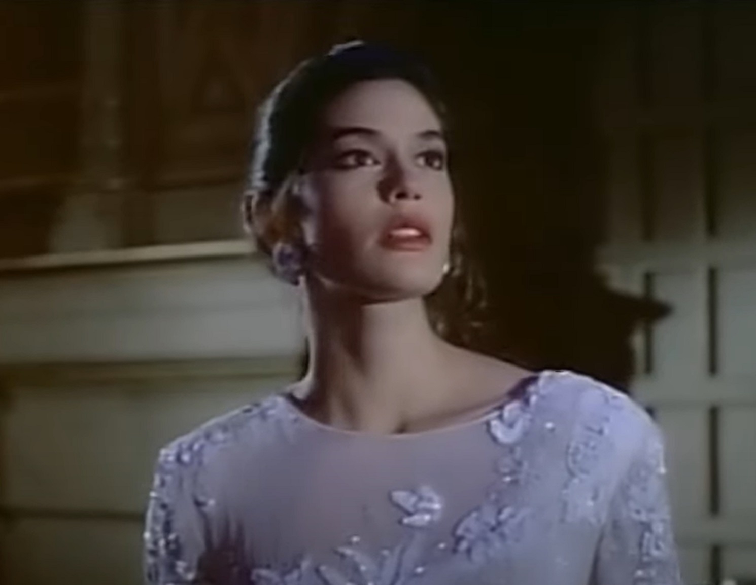 Screenshot: Teri Hatcher is looking at side with upset face - from Macgyver (1985–1992)