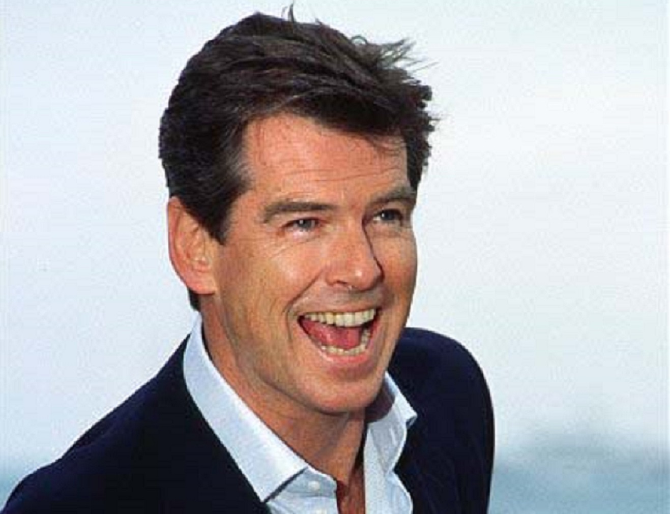 Pierce Brosnan,looking at side and smiling - 2002