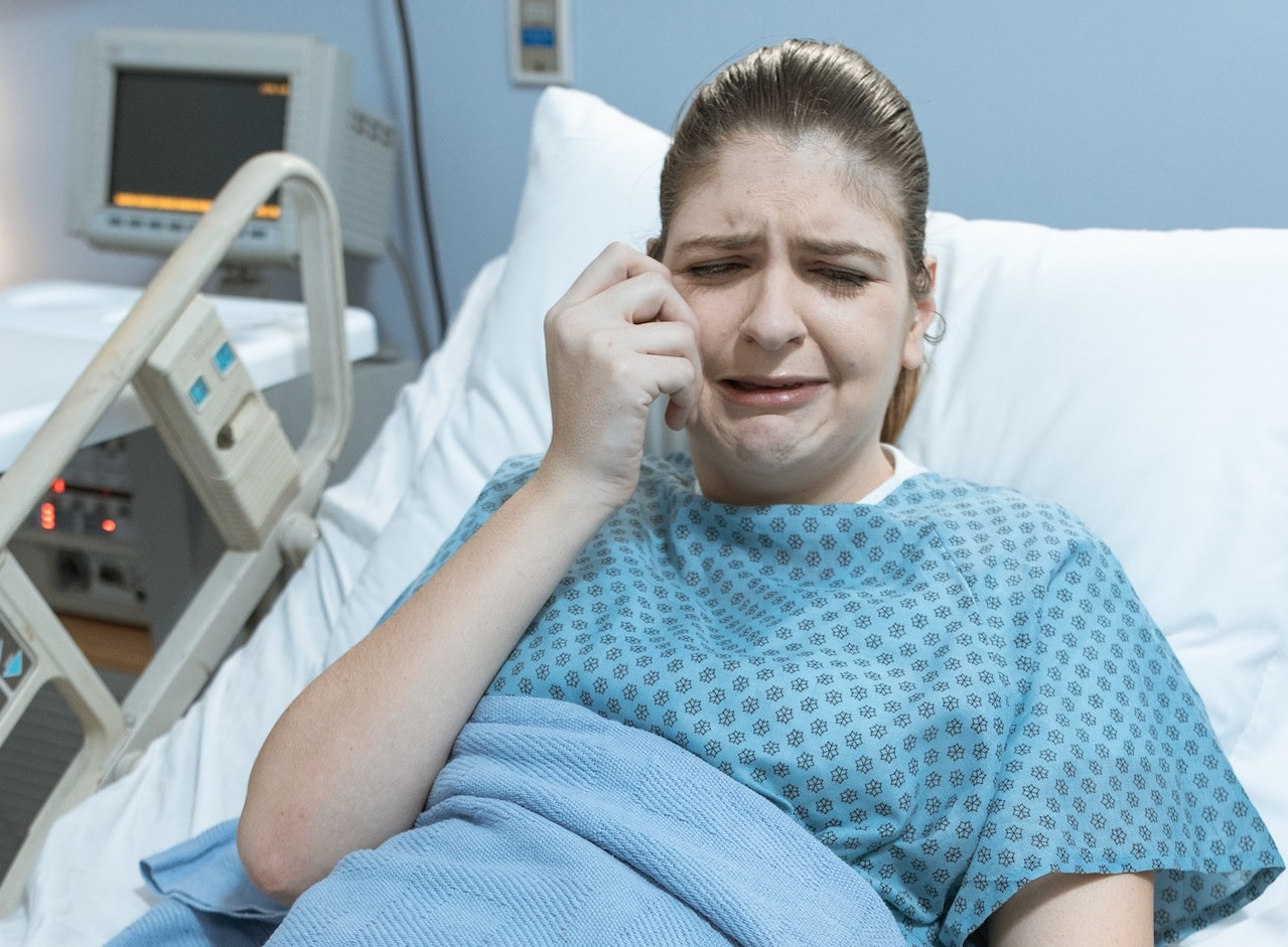 Woman crying at hospital.