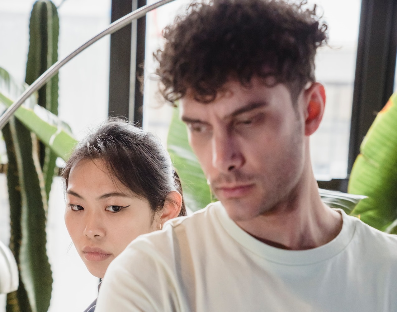 Woman is looking at man with angry face.