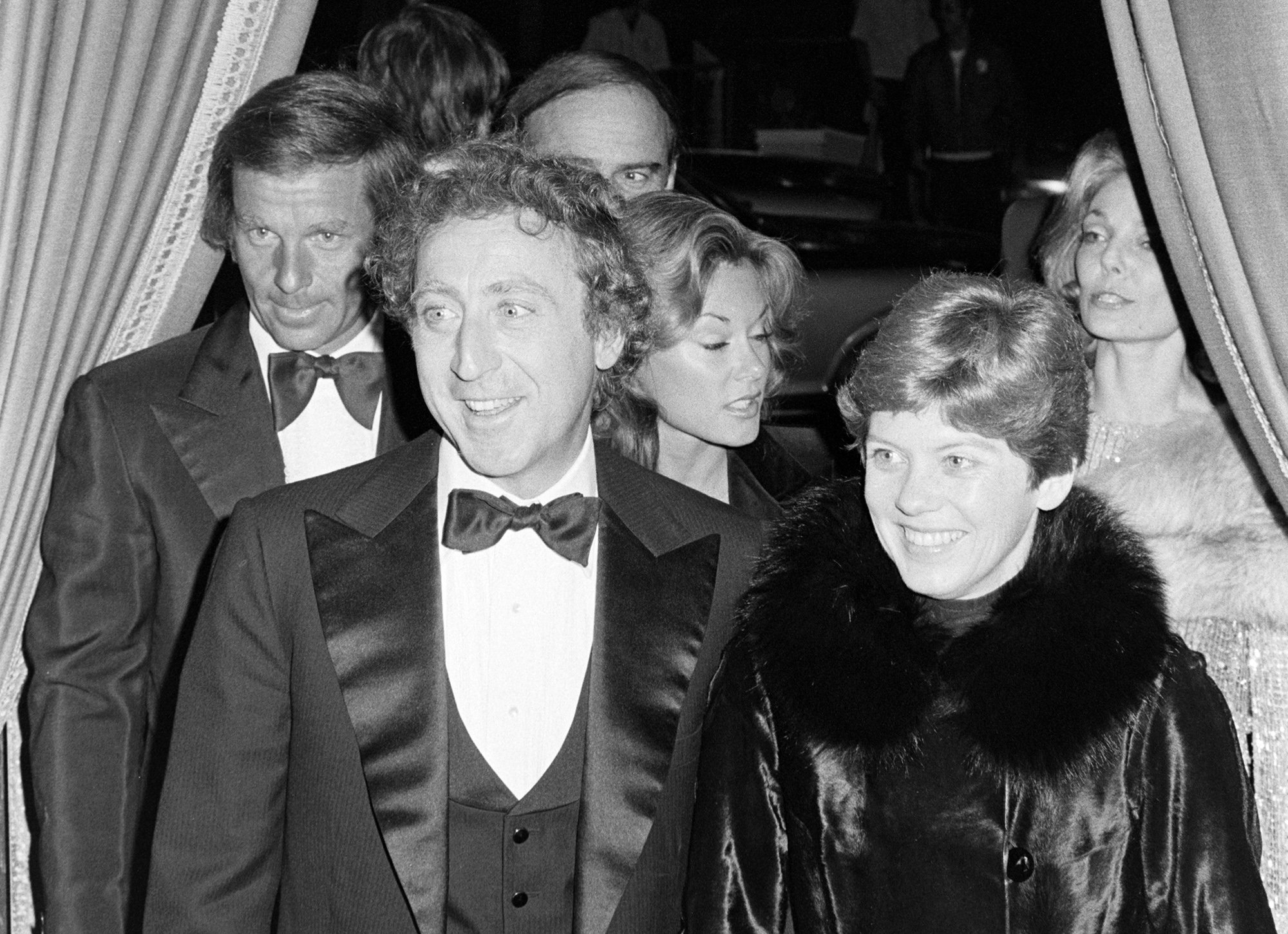 Gene Wilder (2nd from L) attends an American Film Institute event at the Beverly Hilton Hotel in Beverly Hills, California, on March 2, 1977 in tuxedo