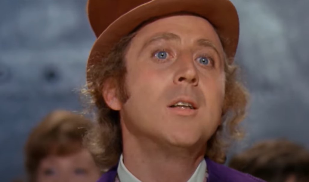 Gene Wilder as  Willy Wonka in purple suit