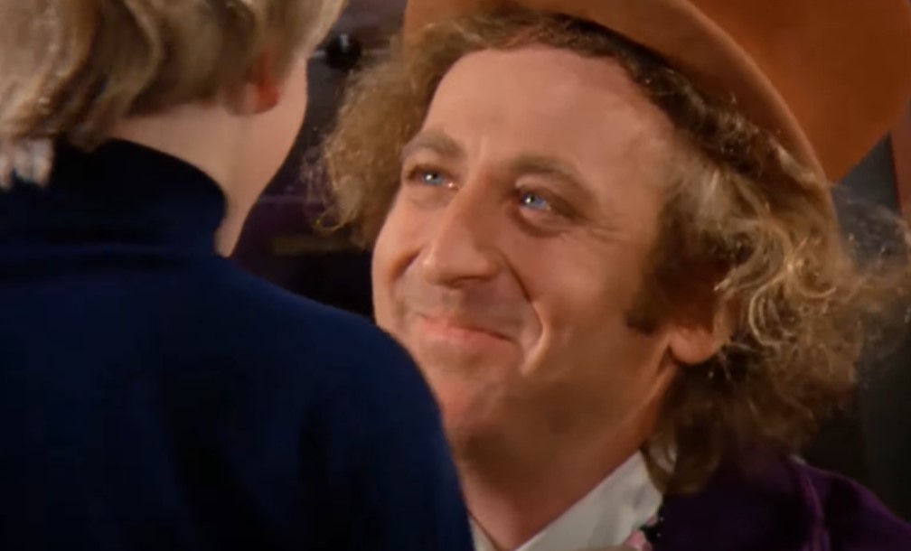 Gene Wilder as  Willy Wonka in purple suit