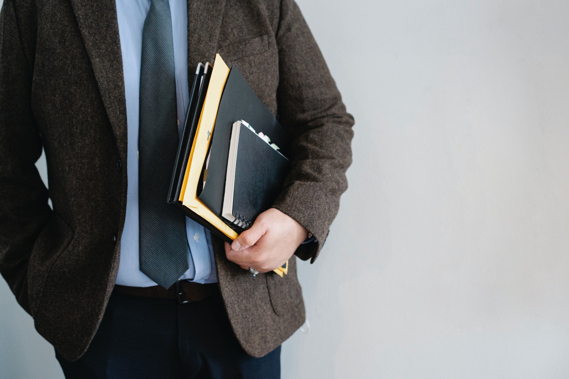 lawyer in suit holding papers for court