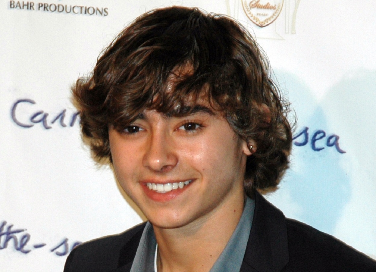 Jansen Panettiere wearing grey shirt and black suit smiling - 2011