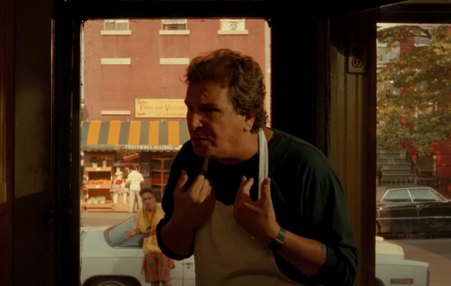 Danny Aiello in movie Do the Right Thing pointing at himself