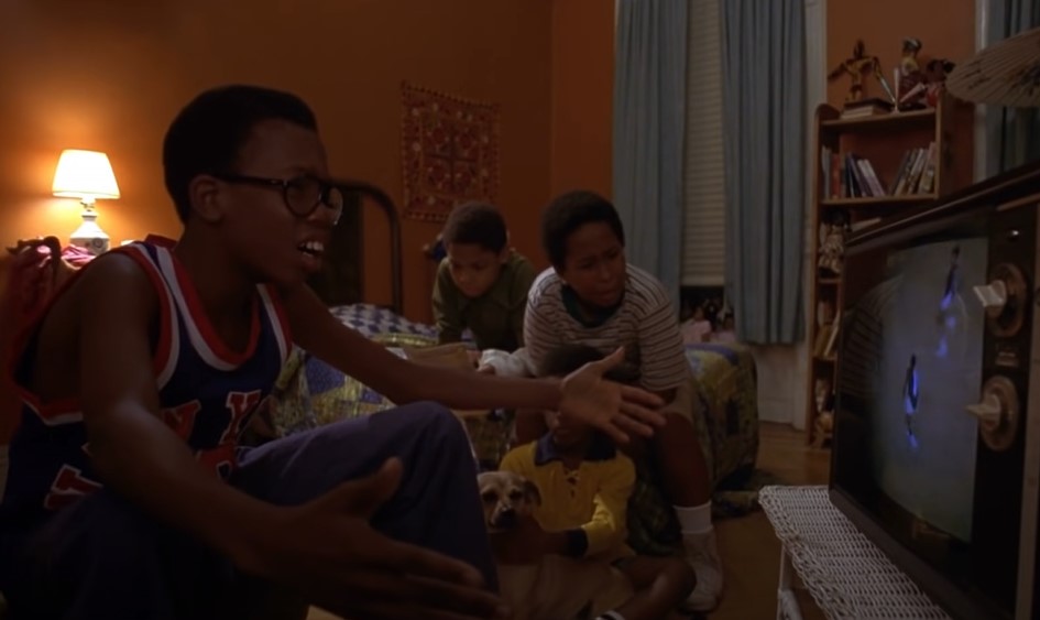 Actors in movie watching tv