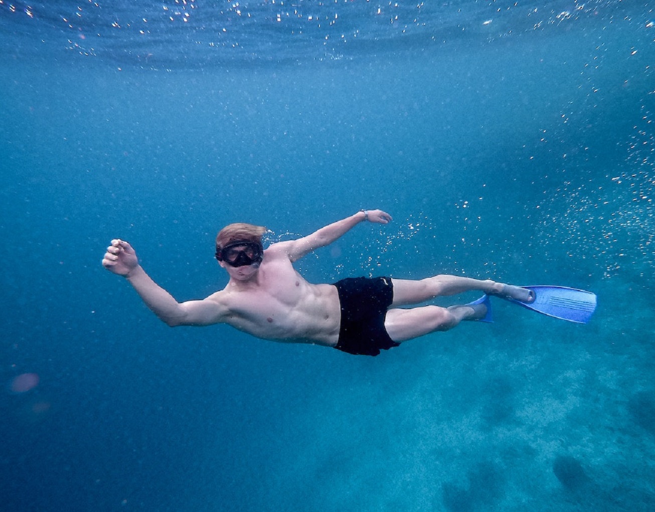 Man diving in the ocean.