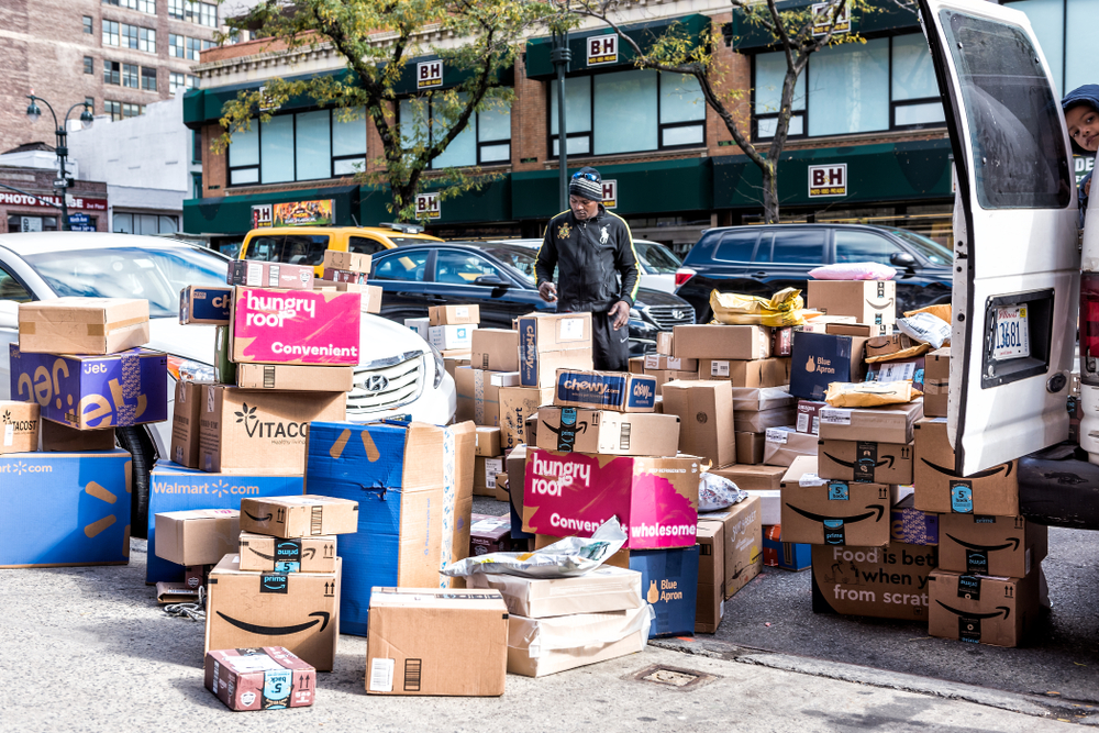 Delivery man with many boxes in NYC