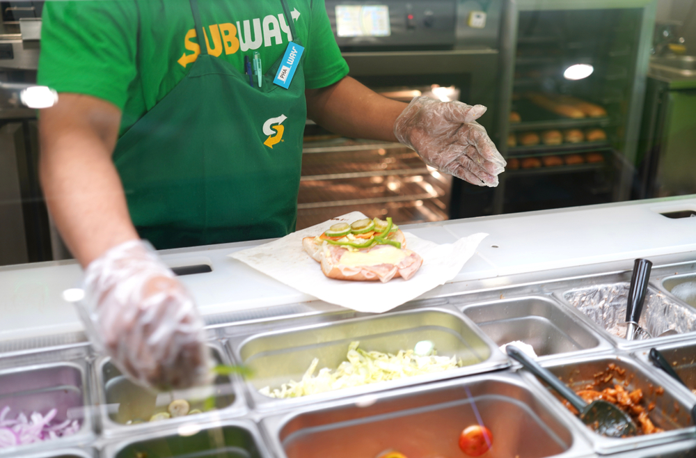 Subway Staff is cooking Subway Sandwich
