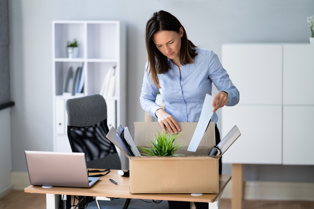 Woman in blue shirt Resigning From Job Or Fired Moving Out Of Office