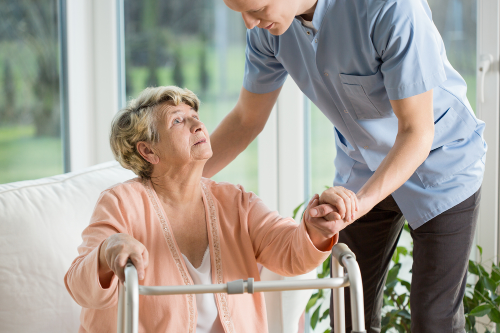 Man in blue uniform working in retirement home