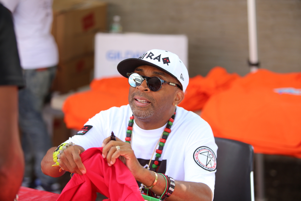 Spike Lee sitting on a chair