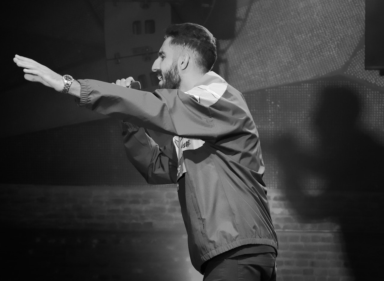 Man performing a stand-up on scene.