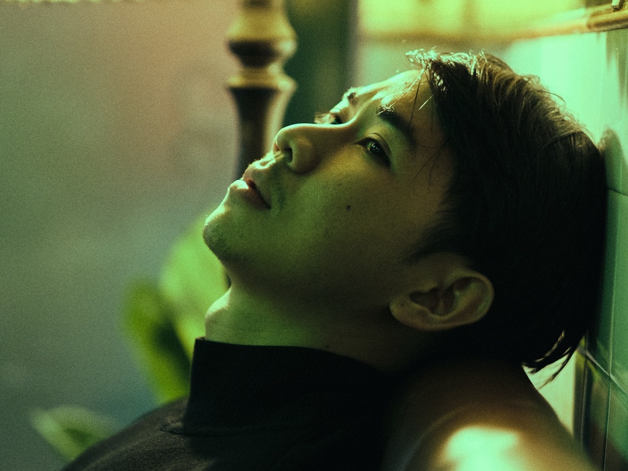 Sad man seating and thinking.