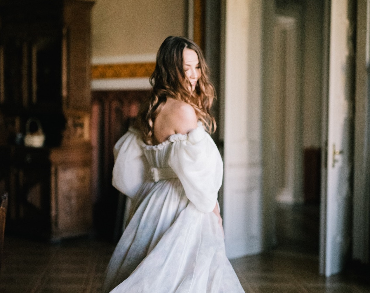 A Bride dancing alone on the floor.