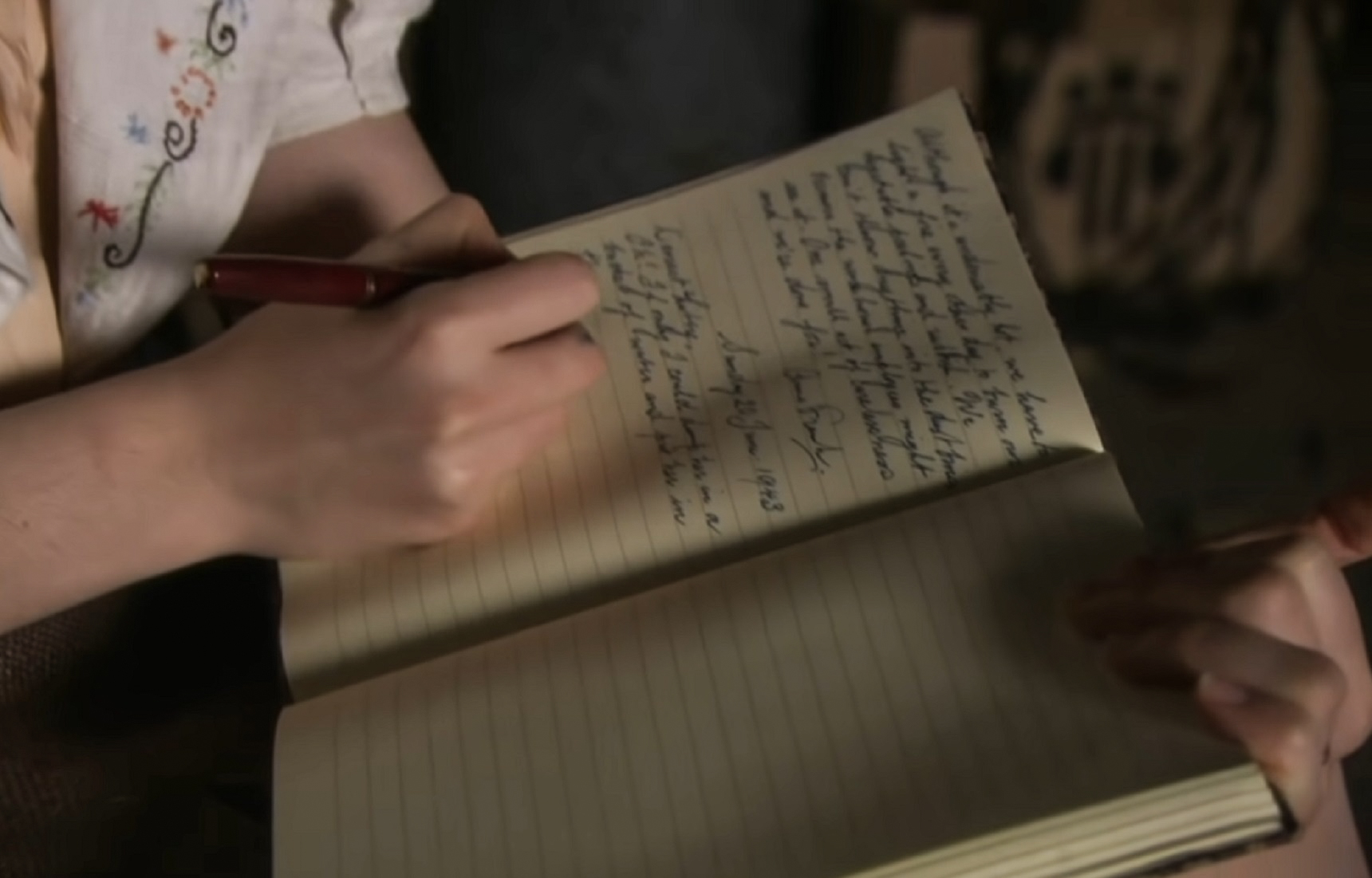 Screenshot: Close Up shot of hands of (Ellie Kendrick) Anne Frank writing in her diary- From BBC ,The Diary Of Anne Frank (2009)