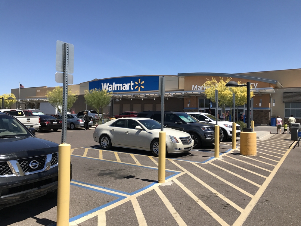 Walmart parking lot with one empty car spot