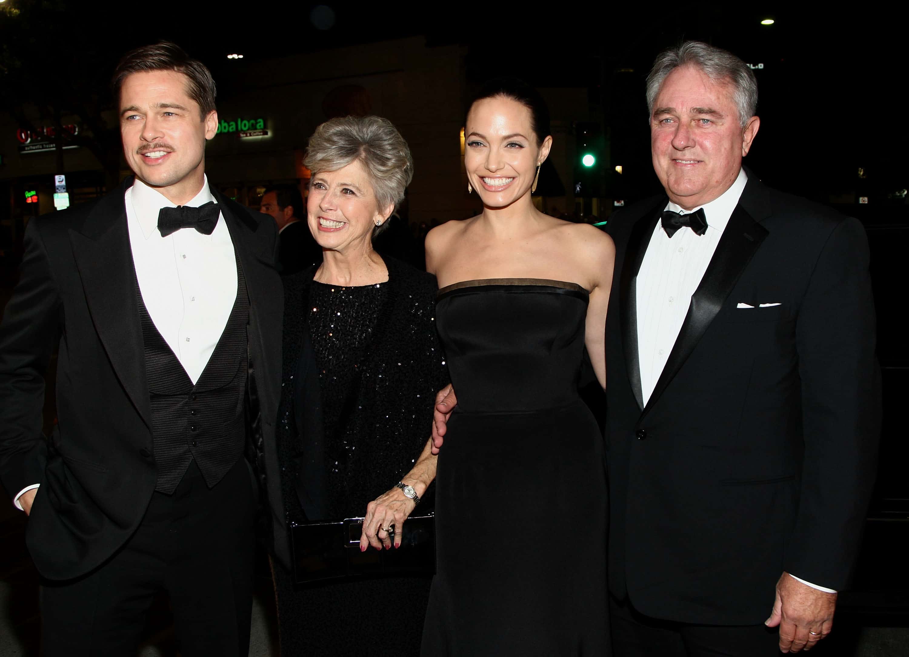 Actor Brad Pitt (L) with his parents and Angelina Jolie (second from R) arrive at the premiere of Paramount's 