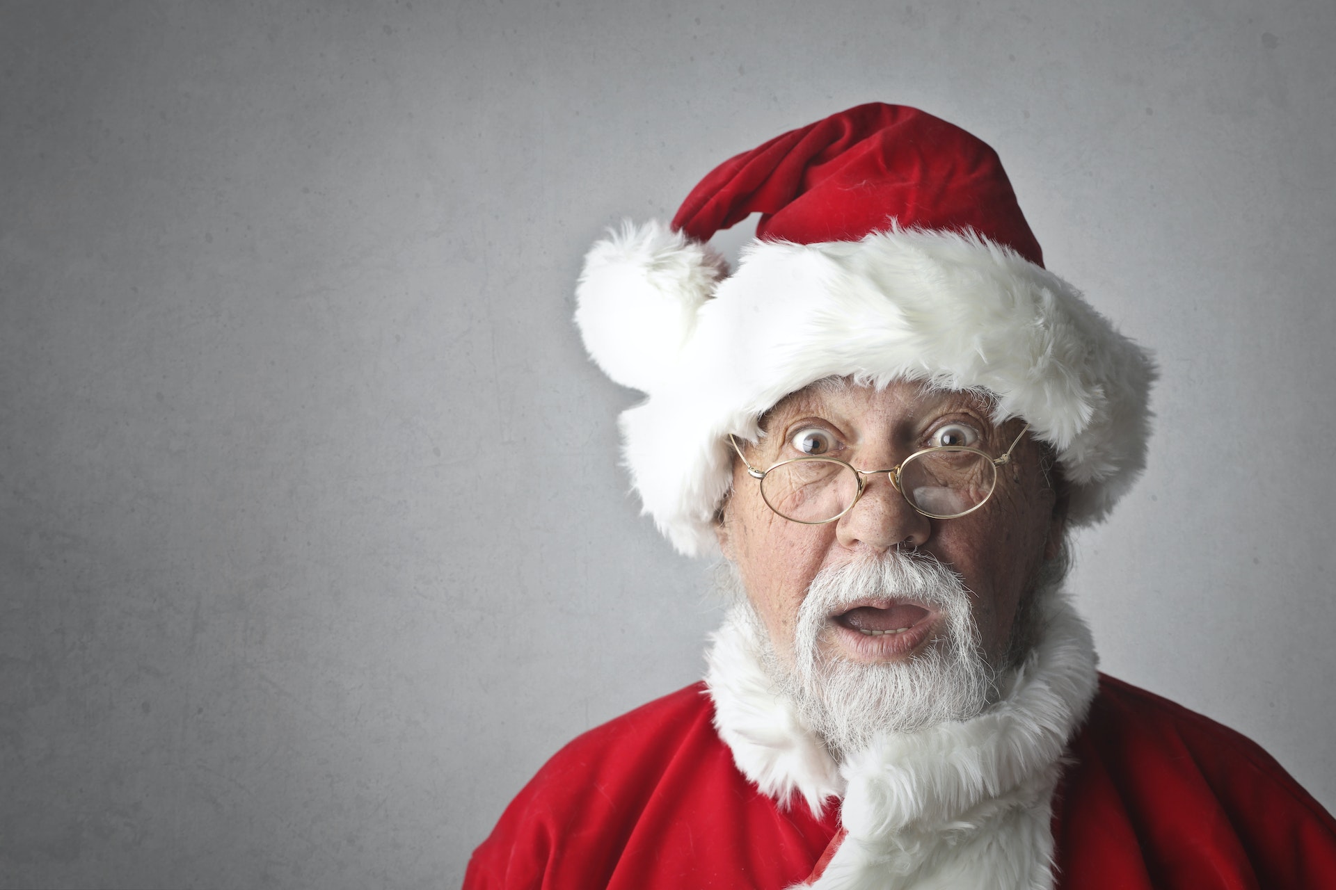 Shocked man in santa claus costume