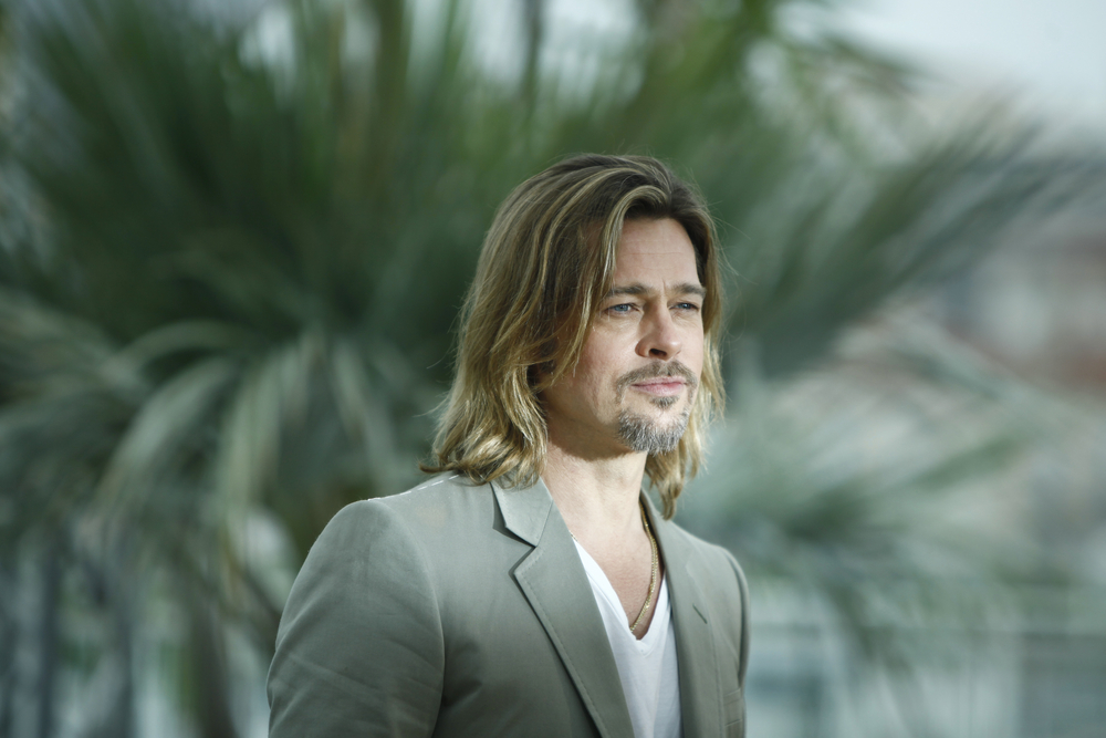 US actor Brad Pitt poses during the photocall of 'Killing them Softly' presented in competition at the 65th Cannes film festival on May 22, 2012 in Cannes in gray jacket