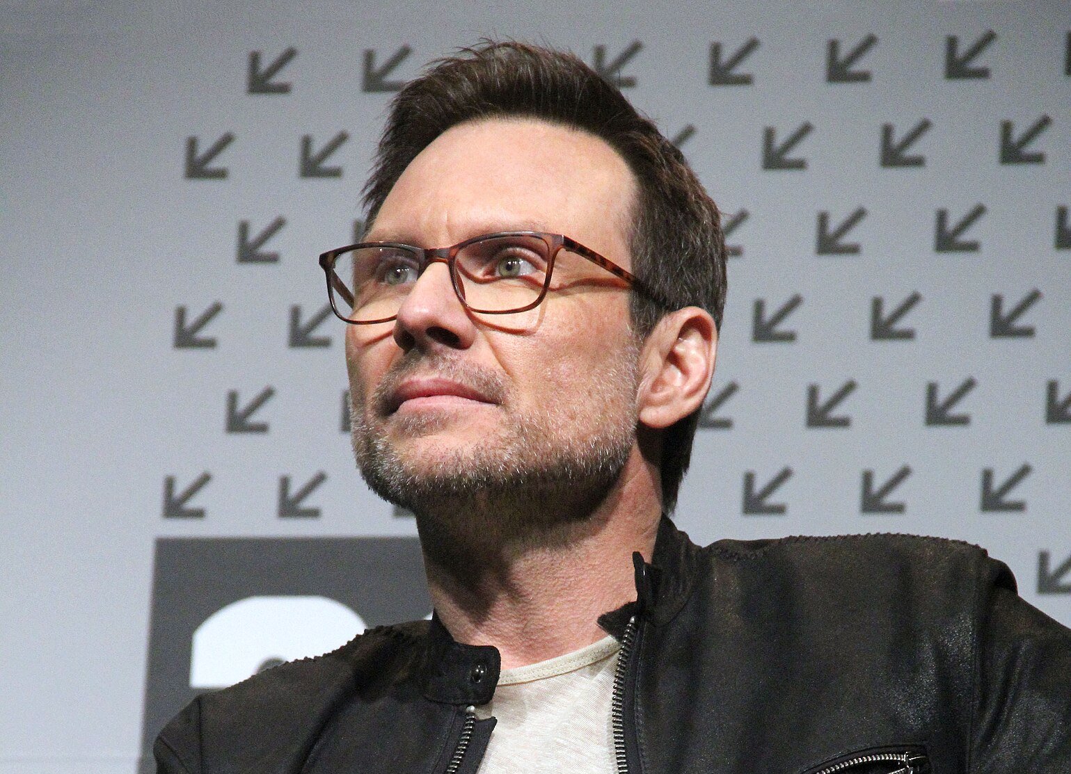 Christian Slater during a panel about Mr. Robot (TV series) in leather jacket