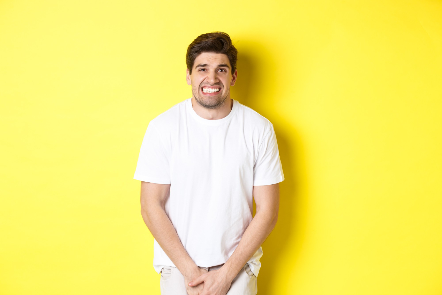 Young man need to use the bathroom.