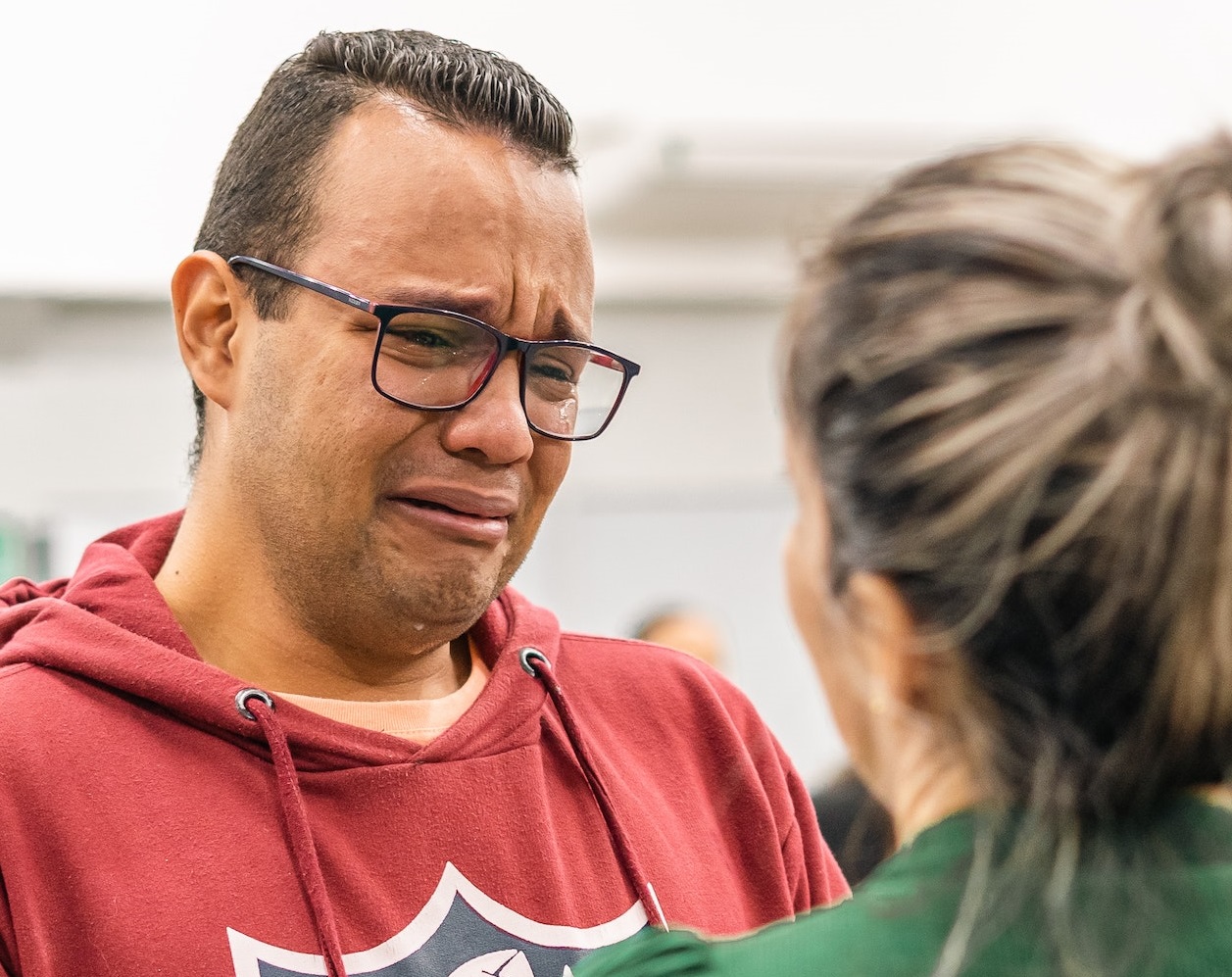 Man is crying and talking with girl.