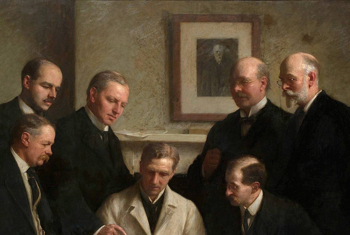 Group portrait of the Piltdown skull being examined