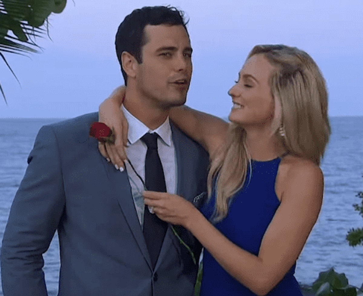 Screenshot: Higgins and Bushnell are hugging outside on the beach looking happy - from The Bachelor (American Tv Series)