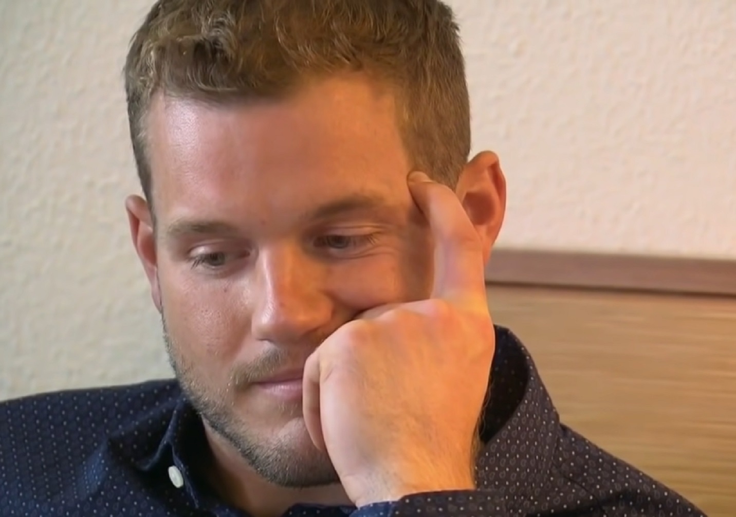 Screenshot: Colton Underwood is looking at side with sad face - from The Bachelorette (American Tv Series)
