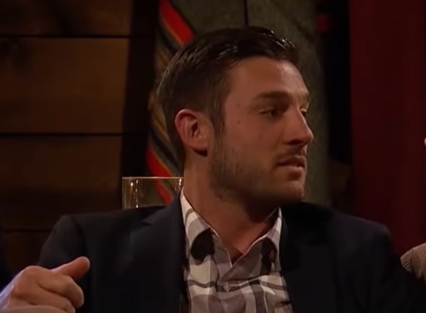 Screenshot: Garrett Yrigoyen is looking at side and talking - from The Bachelorette (American Tv Series)