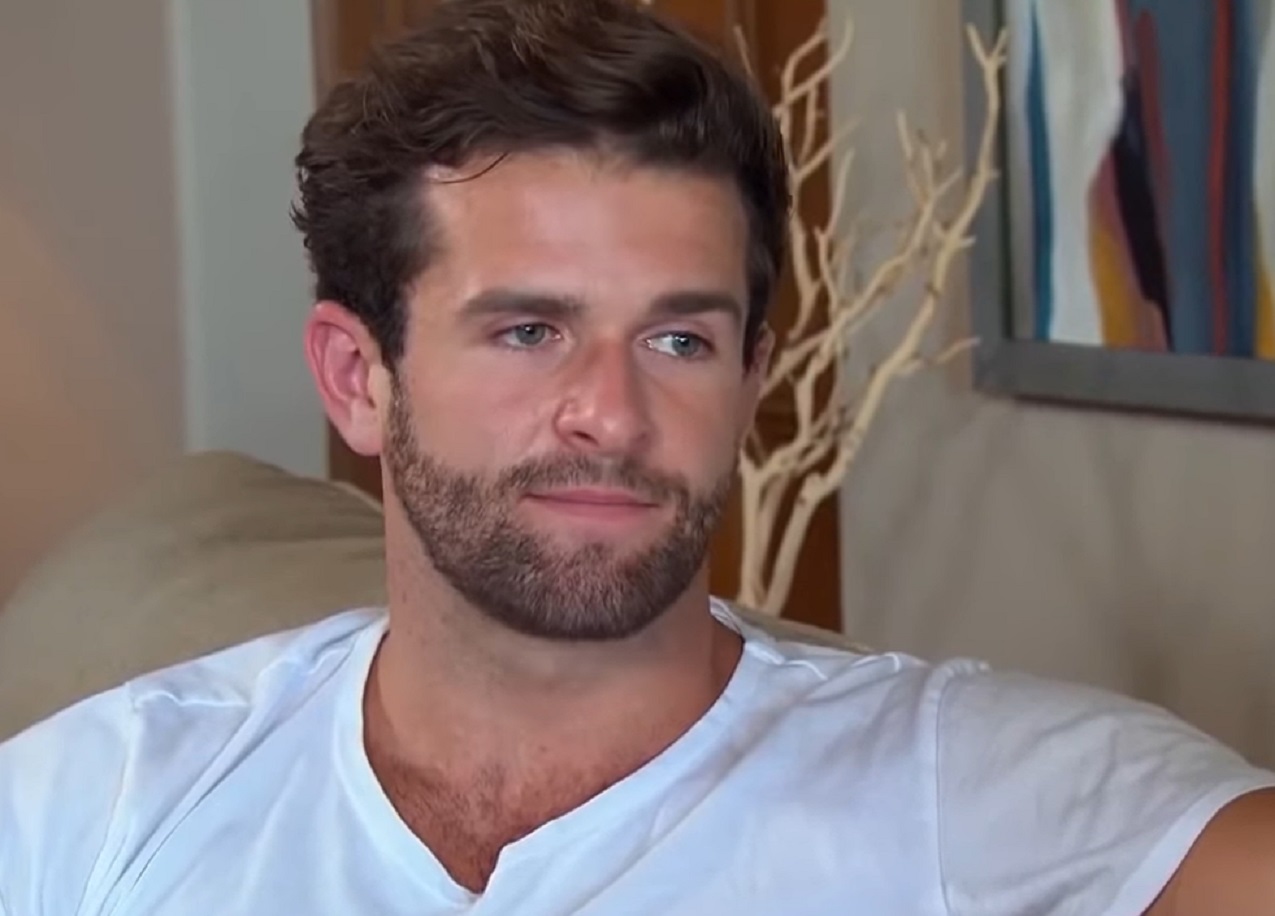 Screenshot: -  Jed Wyatt wearing white shirt is looking at side and talking - from The Bachelorette (American Tv Series)