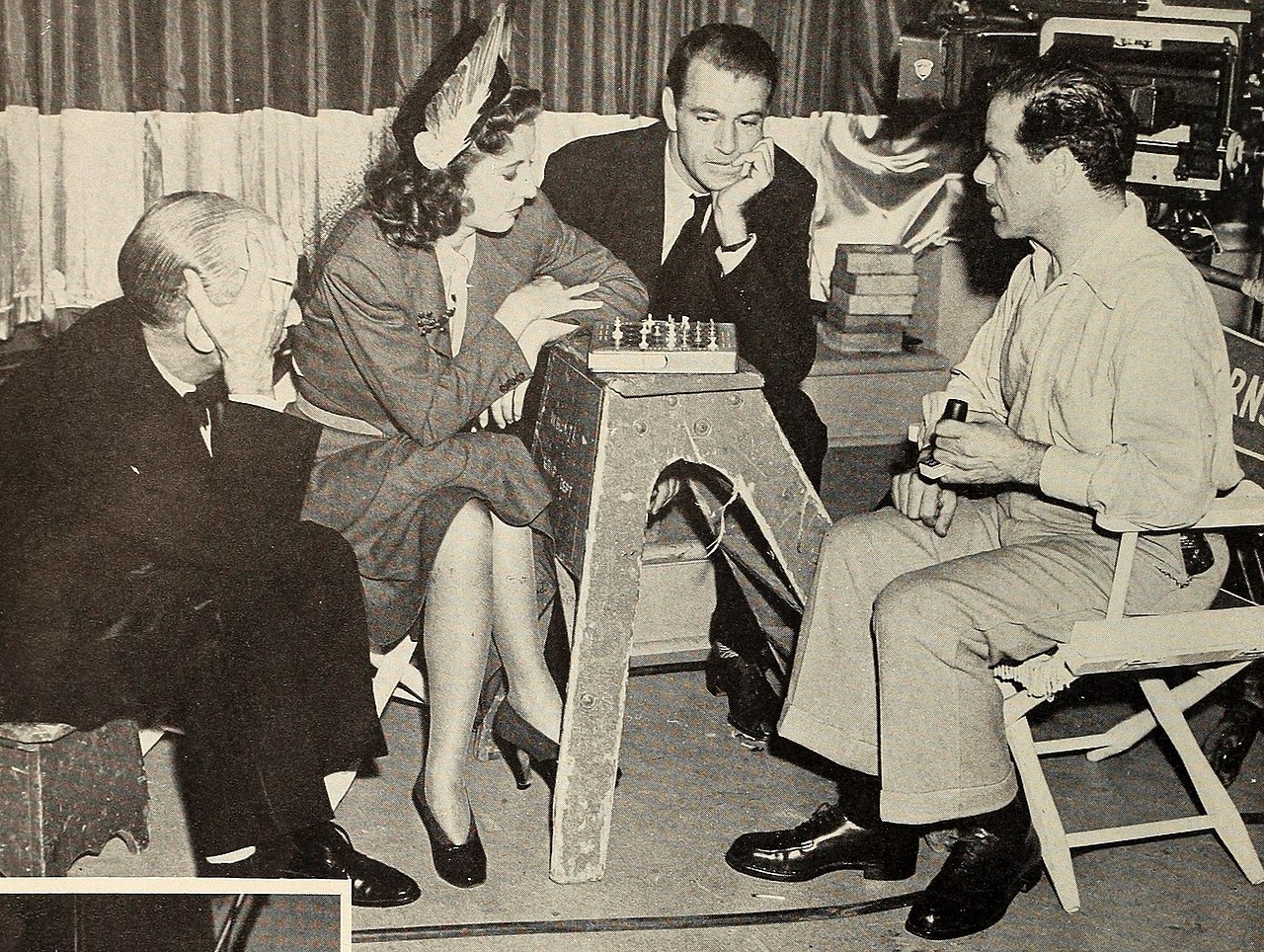 James Gleason, Barbara Stanwyck, Gary Cooper, and Frank Capra playing chess, 1940