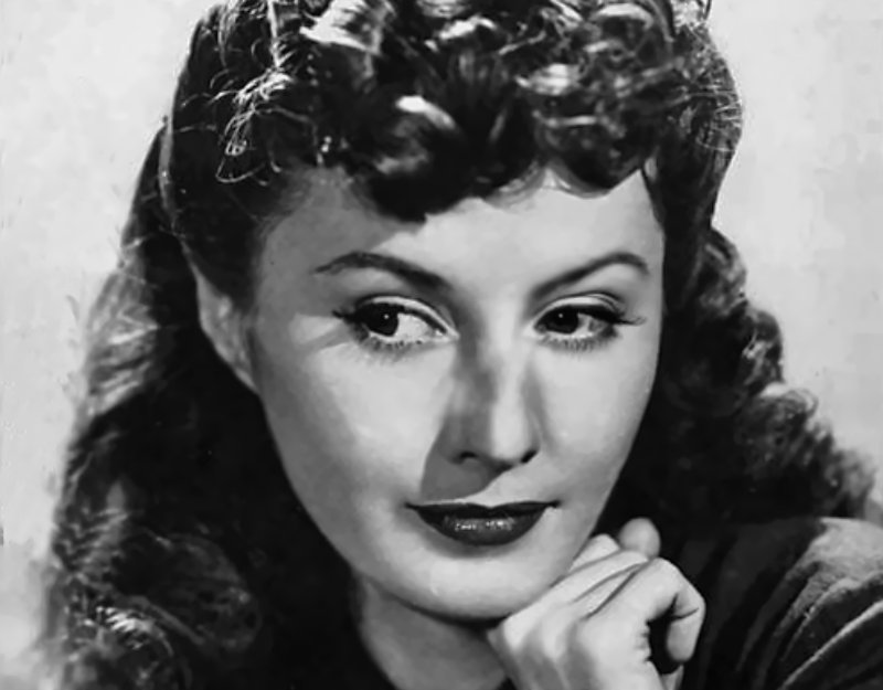 Publicity photo of Barbara Stanwyck in black top