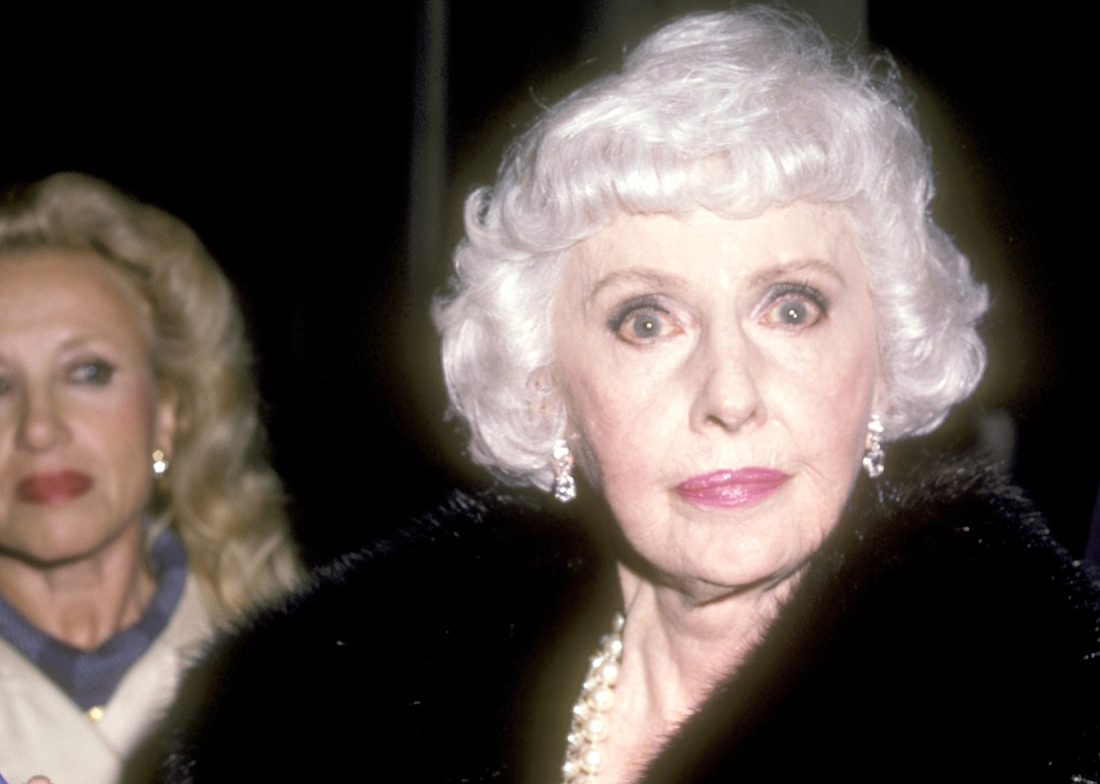 Actress Barbara Stanwyck attends the Party for the Cast of Dynasty on October 25, 1985 at Beverly Wilshire Hotel in Beverly Hills, California in coat and jewelry