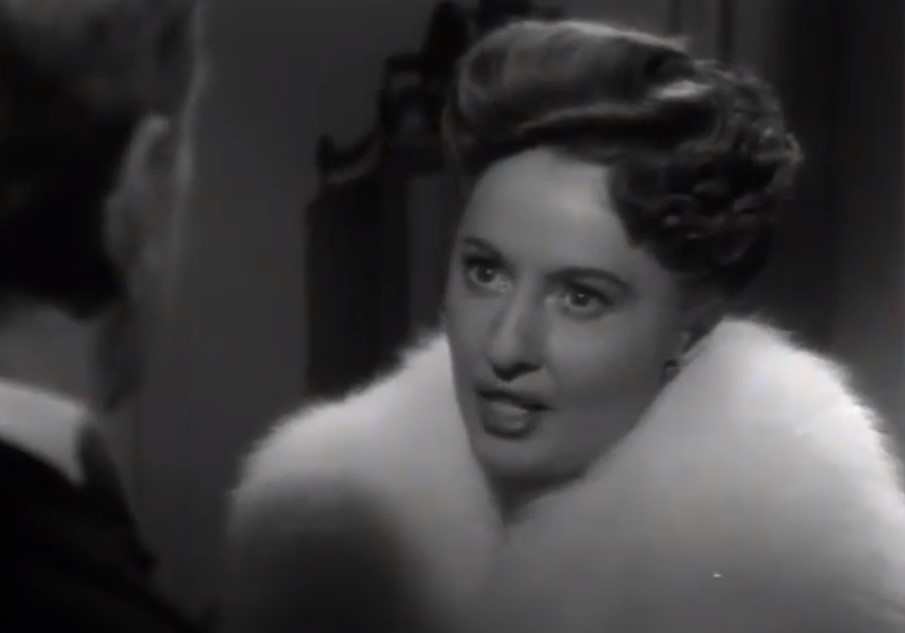 Barbara Stanwyck in Titanic wearing a coat