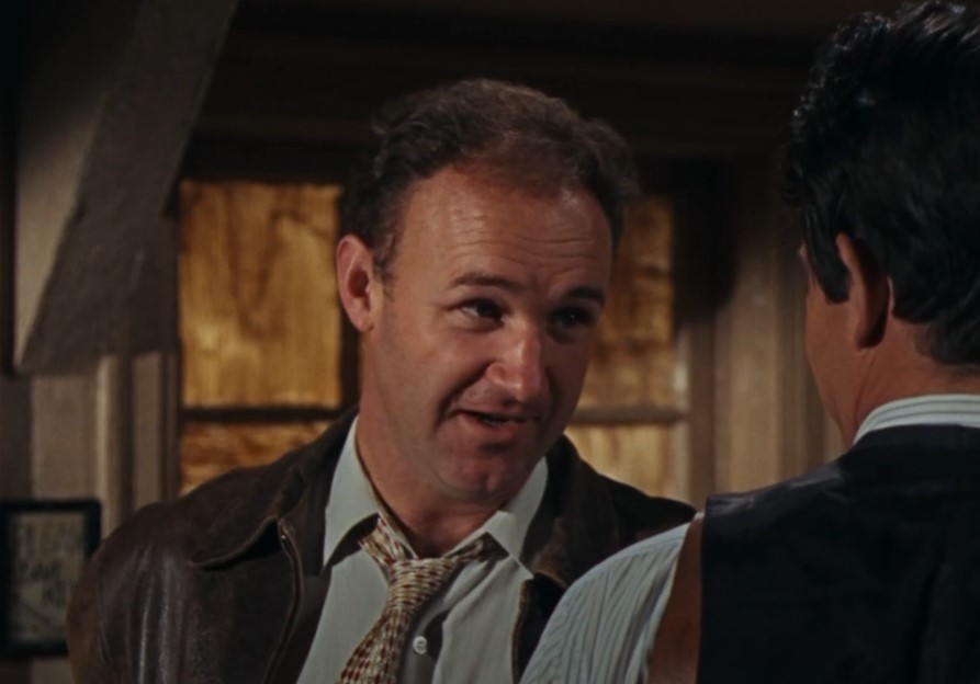 gene hackman in  bonnie and Clyde wearing a jacket and tie