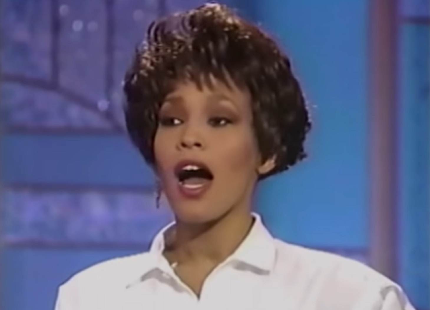 Screenshot of Whitney Houston is talking and looking at side - from Whitney (2018)
